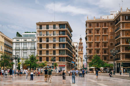 Valencia, Spain - June 3, 2016: Modern buildings on Plaza de la Virgen Cathedral Square in a central location of the city.のeditorial素材