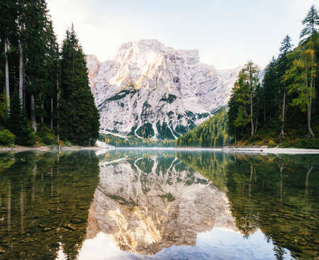 View of Braies Lake with reflection in Dolomites mountains in the morning, Pragser Wildsee, South...