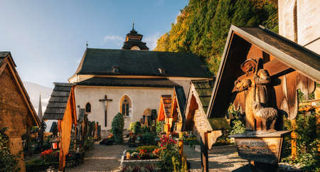 Hallstatt, Austria: Panoramic view of small beautiful grave yard near church with crosses and monuments in Hallstattの写真素材