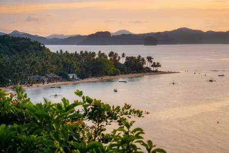 Aerial view of Las Cabanas Beach at El Nido at sunset, Philippinesの写真素材