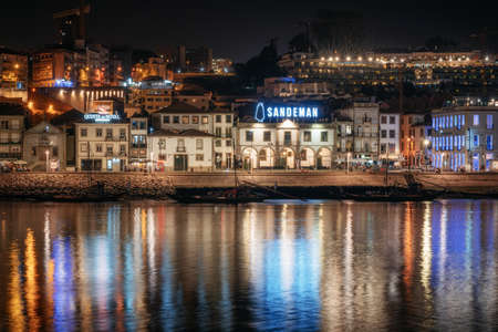 Vila Nova de Gaia, Porto, Lisbon - September 27, 2018: Panoramic view of Douro river embankment and Vila Nova de Gaia with House of Sandeman from the quarter of Ribeira, Porto, in Portugalのeditorial素材
