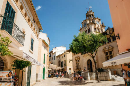 Alcudia, Mallorca, Spain - May 23, 2015: Architecture of Majorca. The tower with big clock of City town hall in Old Town of Alcudia, Mallorca, Balearic island, Spainのeditorial素材