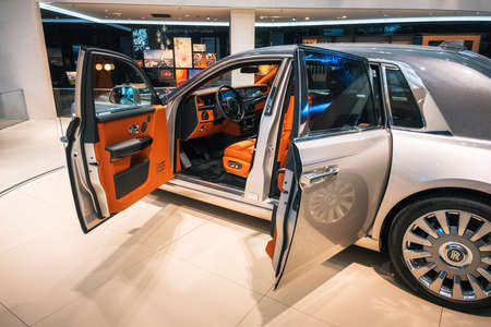 Munich, Germany - December 7, 2017: Interior view of luxury Rolls Royce Phantom VIII 8 car with opened doors, dashboard and steering wheelのeditorial素材