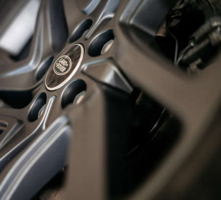 Minsk, Belarus - September 24, 2019: Close up of Land Rover logo on dark colored aluminum rim.のeditorial素材