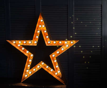 star of light bulbs on a dark background, rock star, incandescent light bulbの写真素材
