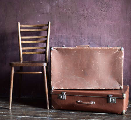 Shabby Vintage Stacked Ancient Suitcases. Travel Concept Brown Luggage Background Bannerの写真素材