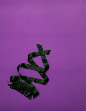 Women's things for a romantic evening - lacy black underwear, black whip, eye patch with fringe on a ultraviolet background. Valentine's Day. Love and passionの写真素材