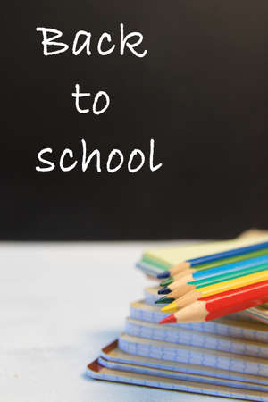 Group of Objects Close up Concept Back To School Color Pencil Notebook Black Blackboard Background Behind. Design Copy Space Education Supplies