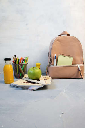 Back to school and happy time! Apple, pile of books and backpackの写真素材