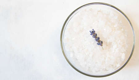 lavender bath salt on white background with lavender flowerの写真素材