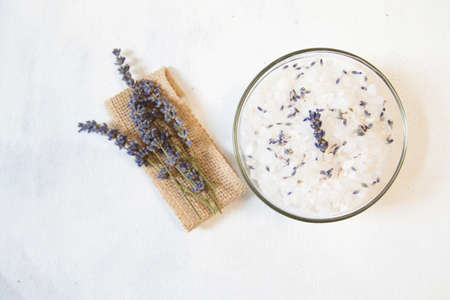 lavender bath salt on white background with lavender flowerの写真素材