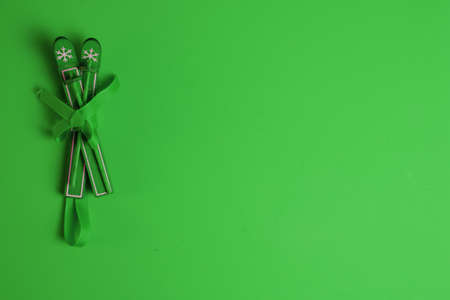 Christams time decoration ski on green backroundの写真素材