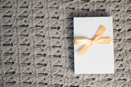Christmas Gifts in White Box with light Ribbon on grey Background. New Year Holiday Composition...