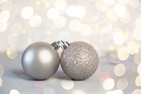 Silver Christmas balls on shiny backgroundの写真素材