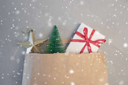 gift boxes in bag and shopping mall on the green table with the holiday season