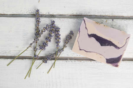 Natural lavender soap with lavender flowers on itの写真素材
