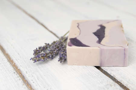 Natural lavender soap with lavender flowers on itの写真素材
