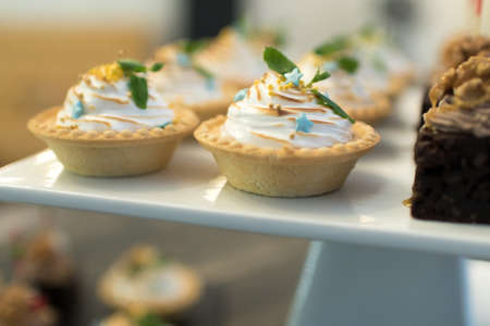 Beautifully decorated catering banquet table with different food snacks and appetizers on corporate...