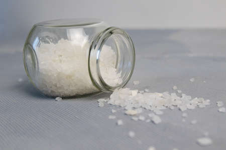 Natural herbal sea salt - perfect for relaxation. Cosmetic jars and bottles with salt,の写真素材