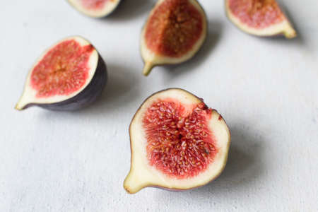 Fresh fig. Fruit with half and quarter on light background. Collection.の写真素材