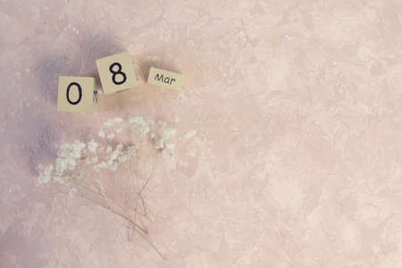 Womens day March 8 with wooden block calendar. Happy mothers day. Spring flowerの写真素材