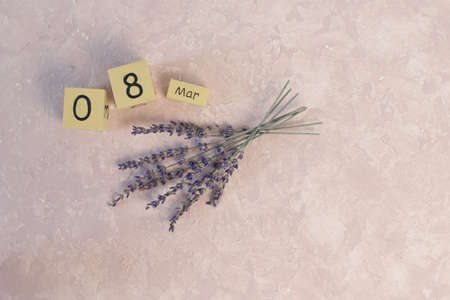 Womens day March 8 with wooden block calendar. Happy mothers day. Spring flowerの写真素材