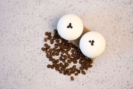 Bath bombs with coffee grains on a white backgroundの写真素材