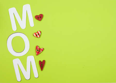 MOM Text with hearts on coloful backround.の写真素材