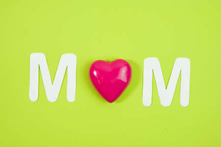 MOM Text with hearts on coloful backround.の写真素材