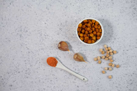 Vegan healthy snack,spicy roasted chickpeas in bowl. Selective focus, space for text.