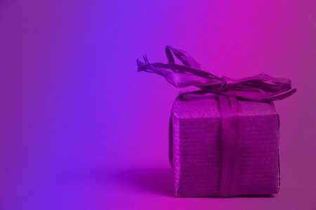 Christmas or new yaer gifts presents in neon colorの写真素材