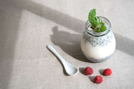Healthy vanilla hemp pudding in a glass with fresh berries