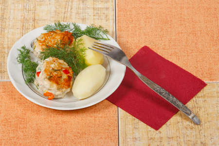 The two appetite cutlets with potato and greensの写真素材