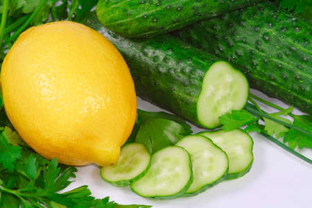 The fresh lemon, cucumbers and greens for diet rationの写真素材