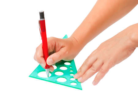Hands draw with a pencil and ruler