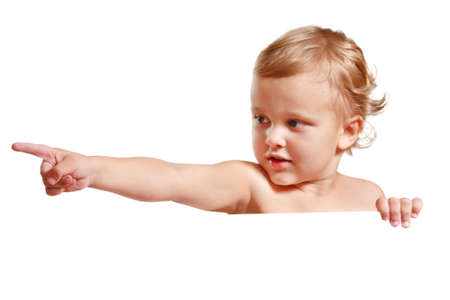 Little cute boy holding a white blankの写真素材