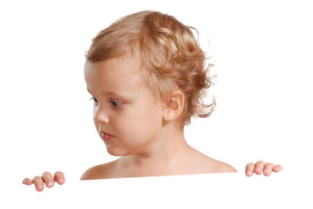 Little cute boy holding a white blankの写真素材
