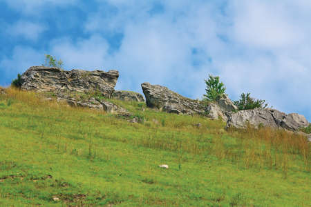 Summer landscape with green mountains and blue sky