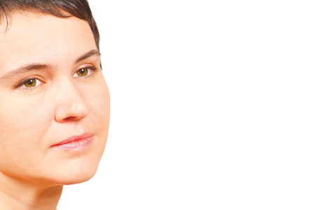 Face of a young girl with green eyes on a white background
