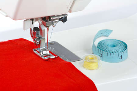 Sewing machine with a red fabric closeupの写真素材