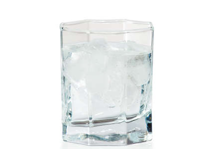 Glass of water and ice on a white backgroundの写真素材