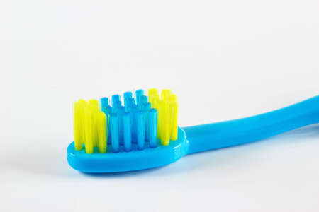 Blue toothbrush for child on white background