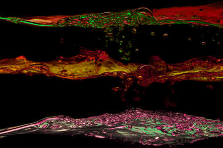 Set of water waves psychedelic colors on a black background