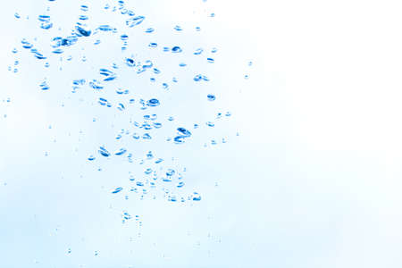 Natural bubbles in the water in a blue tone