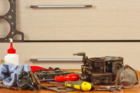 Tools and engine parts in the workplace automotive mechanic closeupの写真素材