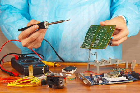 Master solder electronic board of device in the service workshop