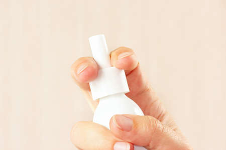 Female hand holding a medical spray close upの写真素材