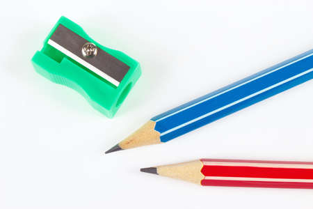Pencils  and sharpener on white desktop close upの写真素材