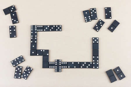 Exciting board game dominoes on a table. View from above.