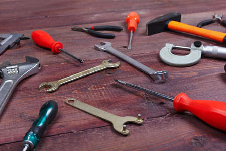 New and old of bench tools for house work on a wooden background.